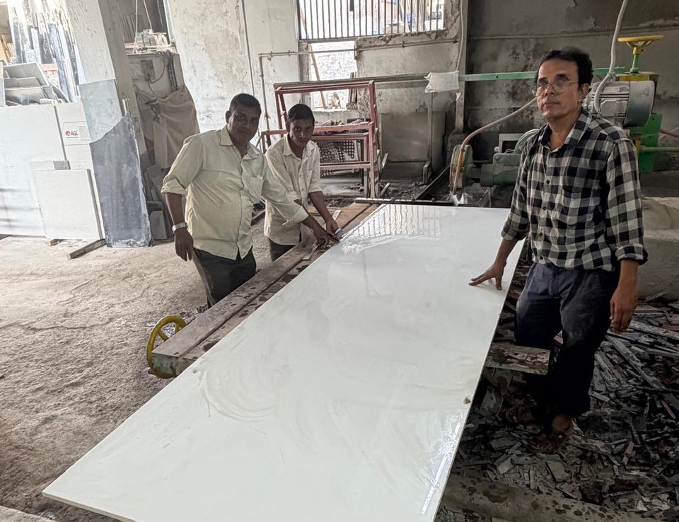 Our workshop team with polished slab
